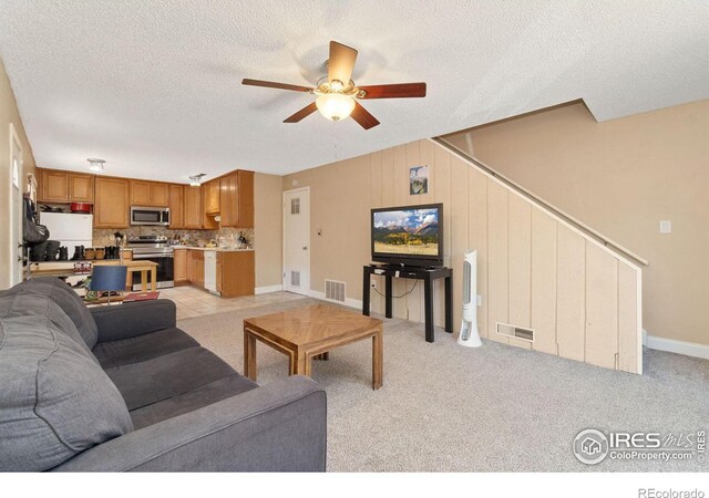 3300 Madison Ave, Boulder, CO 80303 - living room featuring a ceiling fan, light colored carpet, and visible vents