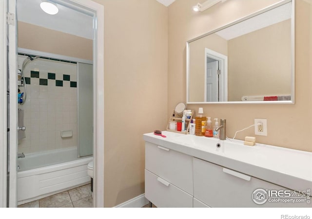 3300 Madison Ave, Boulder, CO 80303 - bathroom with tile patterned floors, vanity, shower / bath combination with glass door, and toilet