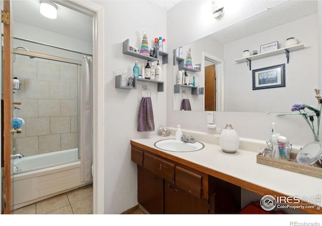 3300 Madison Ave, Boulder, CO 80303 - full bathroom featuring shower / tub combo, tile patterned flooring, vanity, and a textured ceiling
