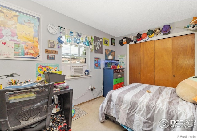 3300 Madison Ave, Boulder, CO 80303 - bedroom featuring a closet, cooling unit, carpet flooring, and a textured ceiling