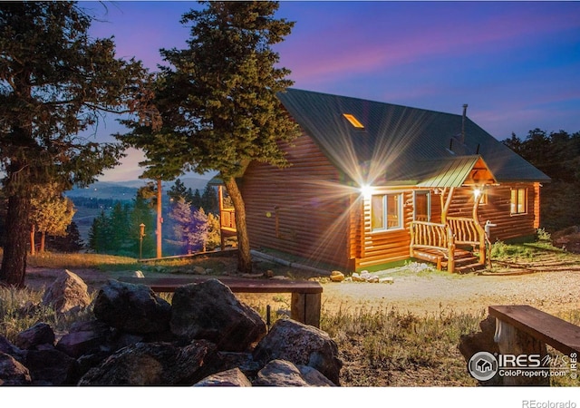 679 Mount Massive Dr, Livermore, CO 80536 - view of front of home featuring log exterior and metal roof