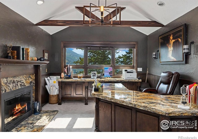 office area featuring a glass covered fireplace, light carpet, and lofted ceiling with beams