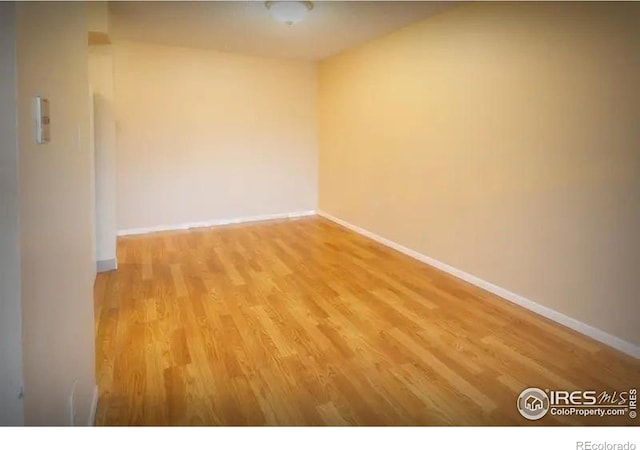 empty room with light hardwood / wood-style floors