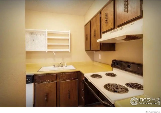 kitchen featuring white appliances and sink