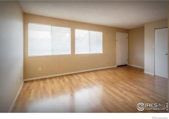 empty room with light wood-type flooring