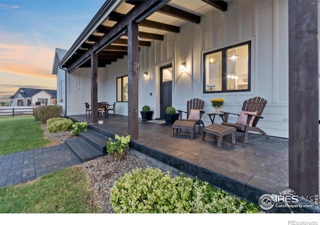 view of patio terrace at dusk