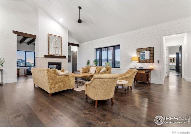 living room featuring a brick fireplace, high vaulted ceiling, and dark wood-type flooring