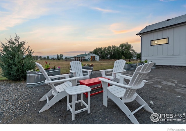 patio terrace at dusk with an outdoor fire pit