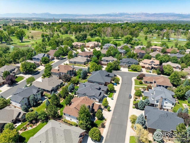 birds eye view of property with a mountain view