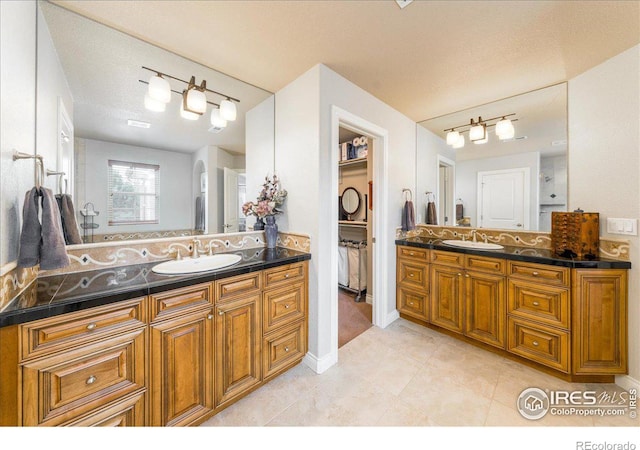 bathroom featuring vanity and tile patterned floors