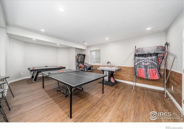 game room with wood-type flooring