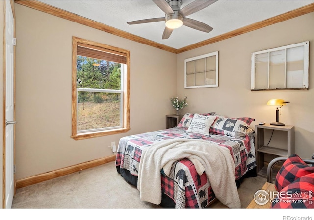 bedroom featuring light carpet, ornamental molding, and ceiling fan