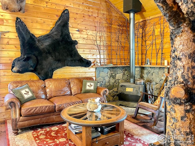 living room with hardwood / wood-style flooring and a wood stove