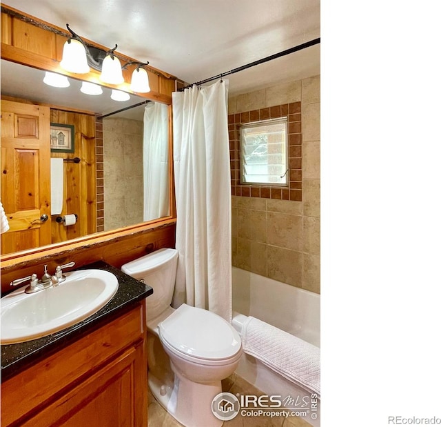 full bathroom with shower / tub combo with curtain, vanity, and toilet