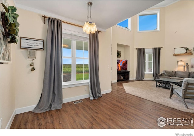 dining room featuring dark hardwood / wood-style flooring and ornamental molding