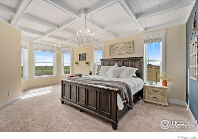 carpeted bedroom with beam ceiling, multiple windows, coffered ceiling, and a chandelier