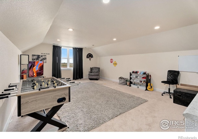 playroom with carpet flooring, lofted ceiling, and a textured ceiling