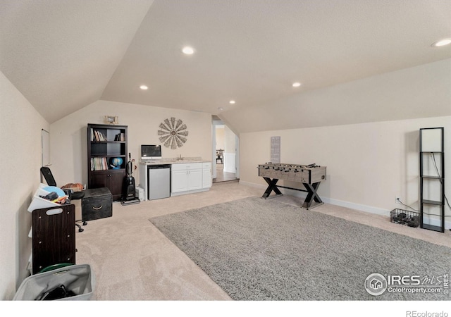 interior space featuring vaulted ceiling and light colored carpet