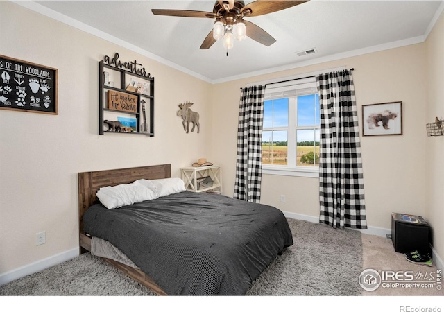 carpeted bedroom with crown molding and ceiling fan