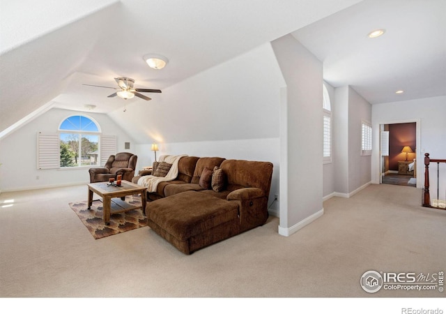 carpeted living room featuring lofted ceiling and ceiling fan