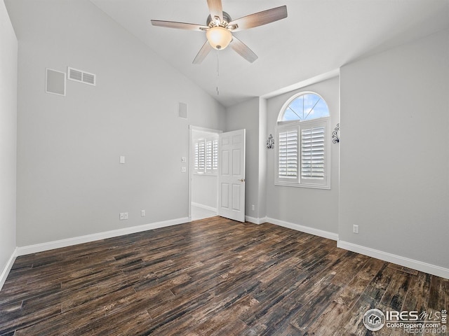 unfurnished room with lofted ceiling, dark hardwood / wood-style floors, and ceiling fan