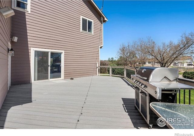 wooden terrace with area for grilling