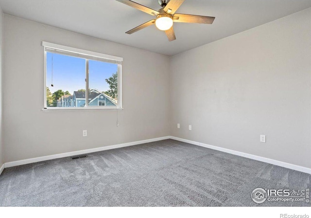 spare room with ceiling fan and carpet floors