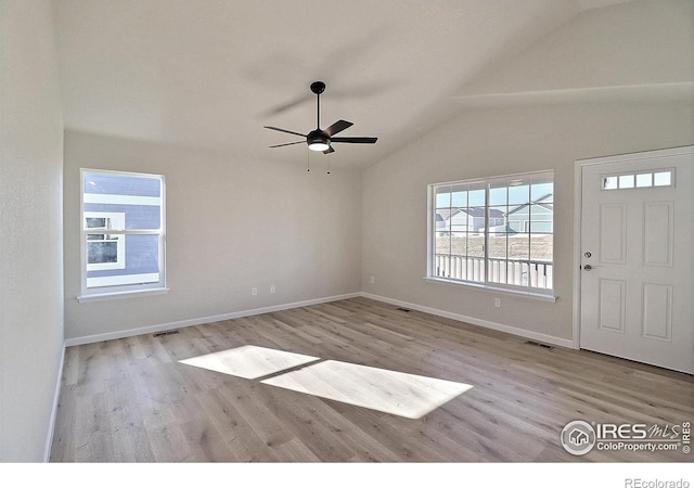 foyer with lofted ceiling, ceiling fan, and light wood-type flooring