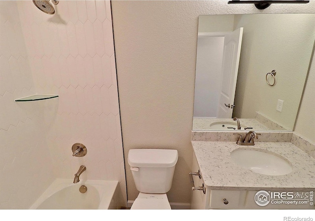 full bathroom featuring vanity, toilet, and  shower combination