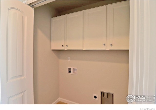 clothes washing area featuring washer hookup, hookup for an electric dryer, and cabinets