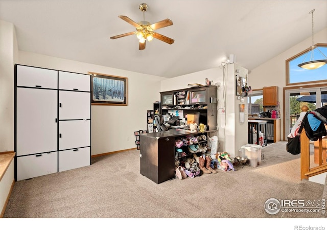 office area with light colored carpet, high vaulted ceiling, and ceiling fan