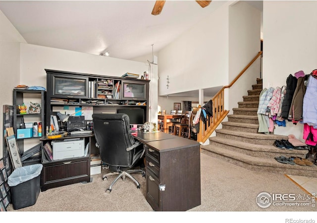 carpeted office space featuring ceiling fan