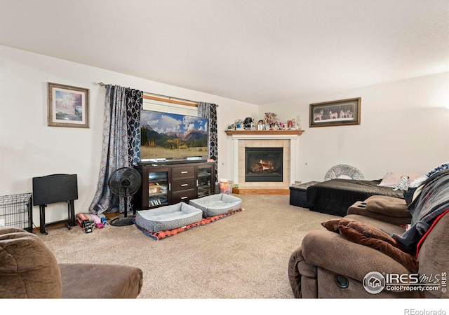 carpeted living room featuring a fireplace