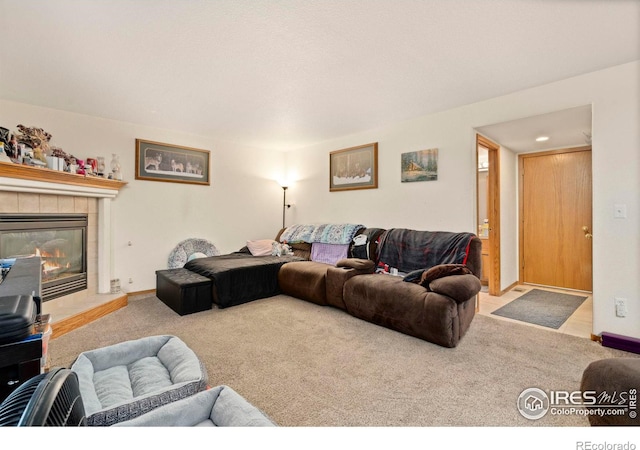 carpeted living room with a fireplace