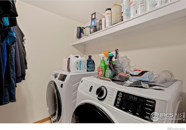 clothes washing area featuring separate washer and dryer