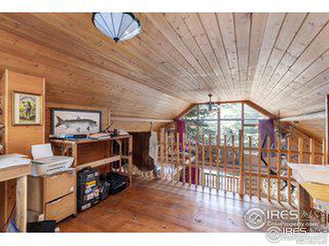 interior space with wood ceiling, hardwood / wood-style floors, and vaulted ceiling