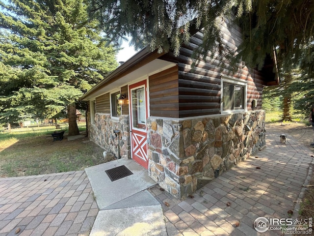 view of side of property featuring a patio