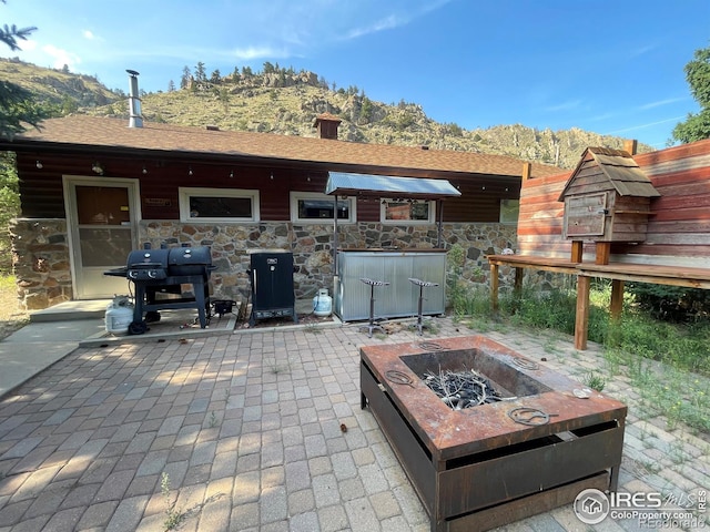 view of patio featuring grilling area and an outdoor fire pit