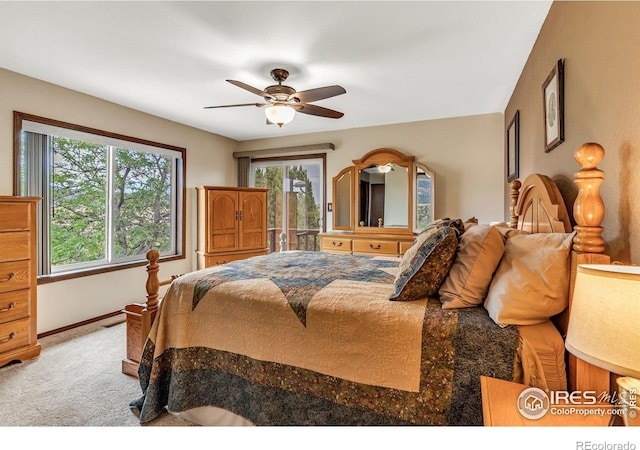 bedroom featuring light colored carpet and ceiling fan