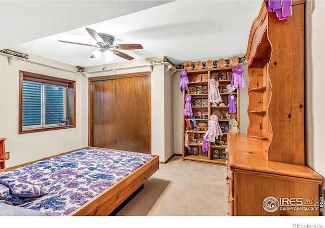 carpeted bedroom featuring ceiling fan