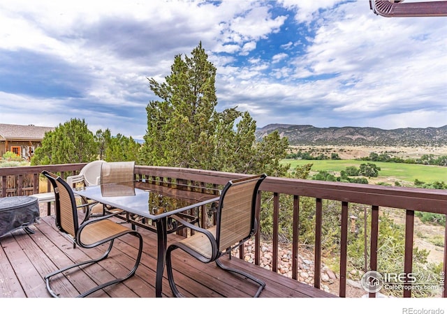 wooden terrace featuring a mountain view