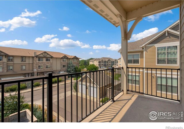 balcony featuring a residential view