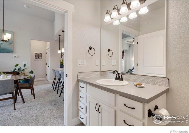 bathroom featuring ceiling fan and vanity