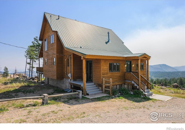 cabin featuring a mountain view