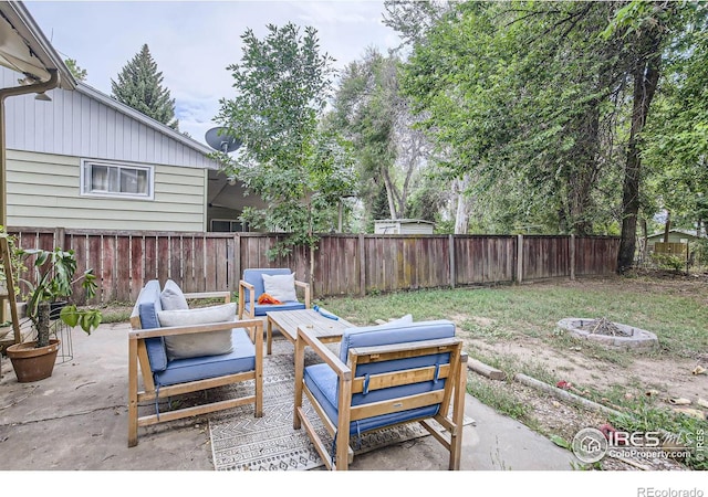 view of patio with a fire pit