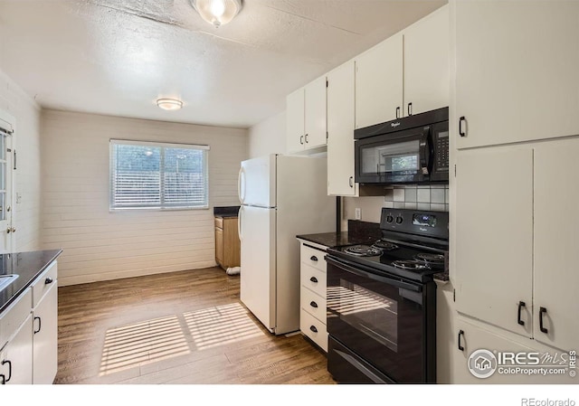 1308 Castlerock Dr, Fort Collins, CO 80521 - kitchen featuring light wood-type flooring, white cabinetry, and black appliances