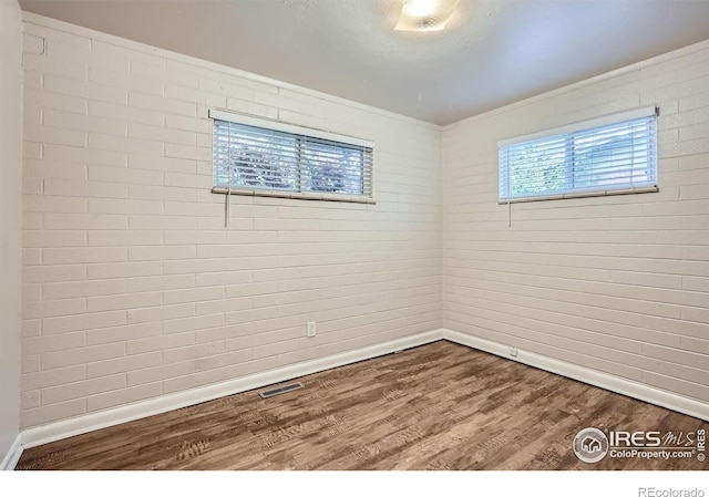 1308 Castlerock Dr, Fort Collins, CO 80521 - spare room featuring hardwood / wood-style flooring and ornamental molding