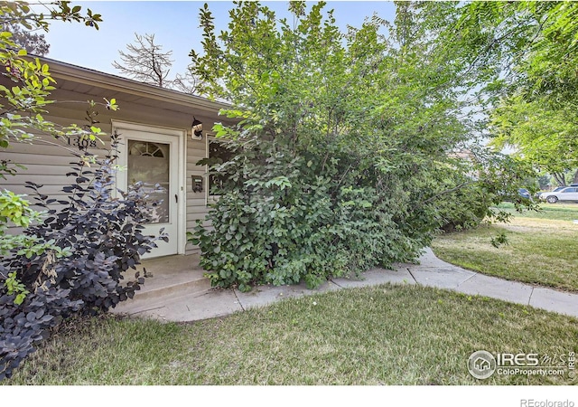 1308 Castlerock Dr, Fort Collins, CO 80521 - property entrance with a yard