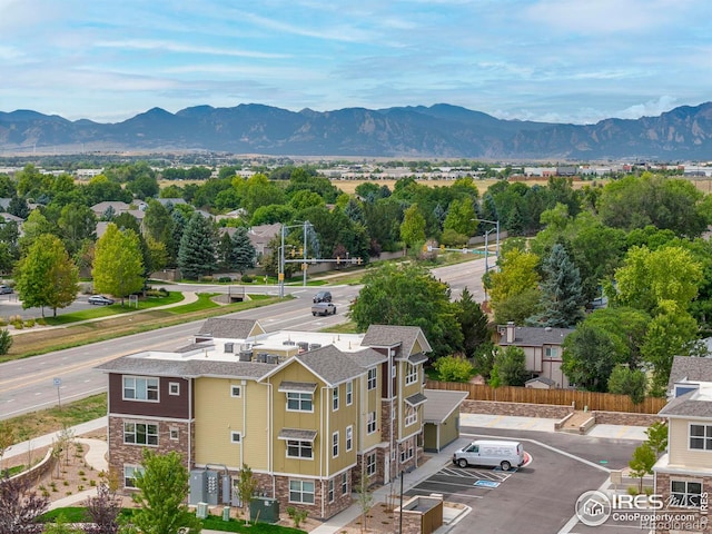 birds eye view of property featuring a mountain view