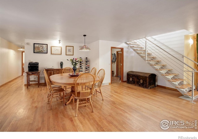 dining area with light hardwood / wood-style flooring